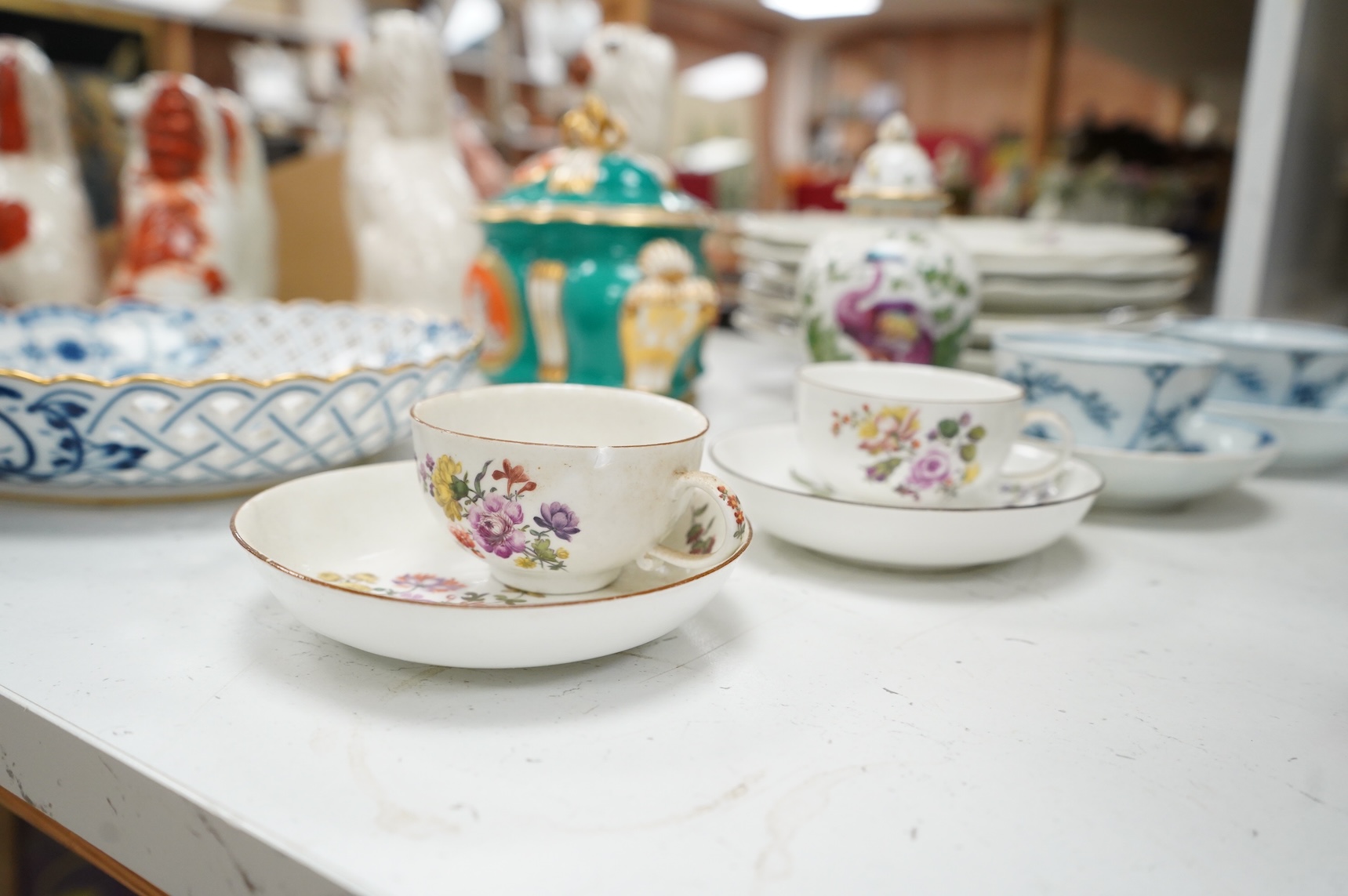 A group of 18th/19th century Continental porcelain, including six 18th century Vienna porcelain plates, a Meissen onion pattern dish, a pair of mid-18th century Meissen teacups and saucers, two tea bowls and saucers and